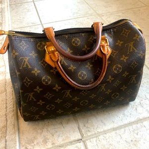 Louis Vuitton Speedy 30 with lock, dust bag and box.